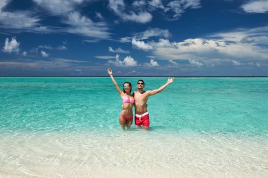 Couple on a tropical beach at Maldives