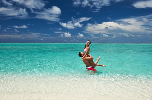 Couple on a tropical beach at Maldives