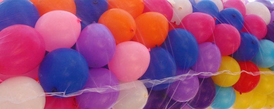 Colored and mixed air baloon in a net