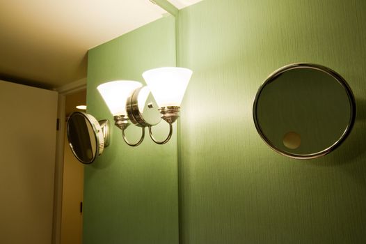 Light and shaving mirror in a bathroom