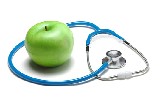 Green apple with stethoscope isolated