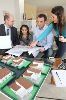 Young family sitting in an architect's office