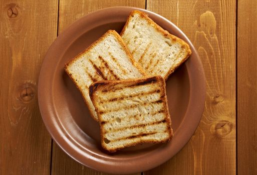 pile  toasted bread slices for breakfast.Close up of toasted white bread in slices