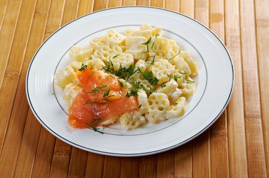 ruote pasta with cream sauce and salmon.closeup