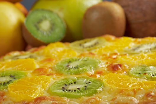 homemade sweet pizza with fruit.with orang kiwi,sauce