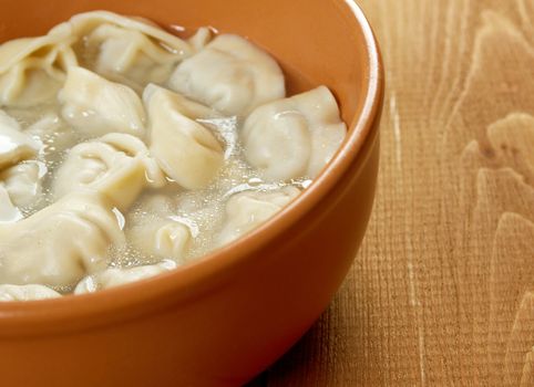 Traditional Russian food "pelmeni".Meat dumplings  with sour cream