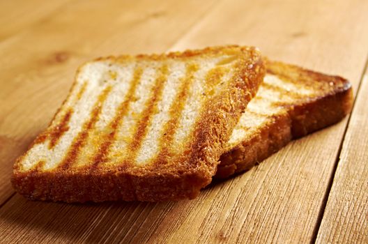 pile  toasted bread slices for breakfast.Close up of toasted white bread in slices