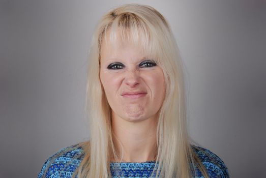 blond woman making a face