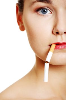 Young woman with broken cigarette. Stop smoking concept.