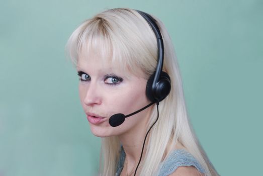 Portrait of young woman with headset