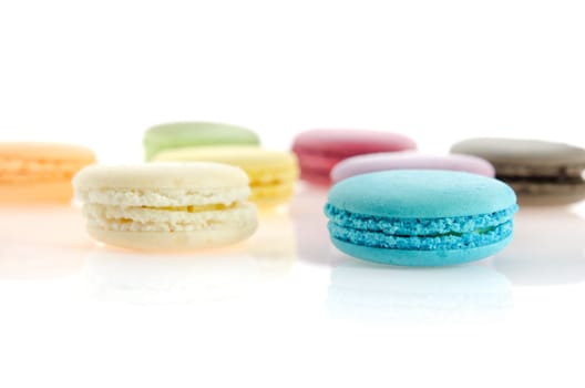 colorful of  french macaroons  over  white with reflection