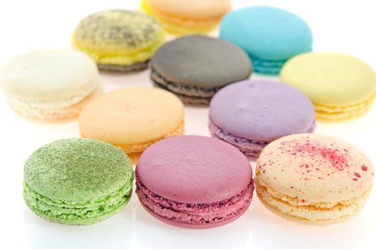 colorful of  french macaroons  over  white .