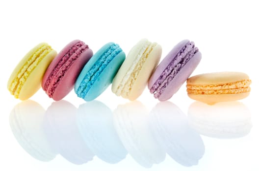  colorful  french macaroons  on  white with reflection