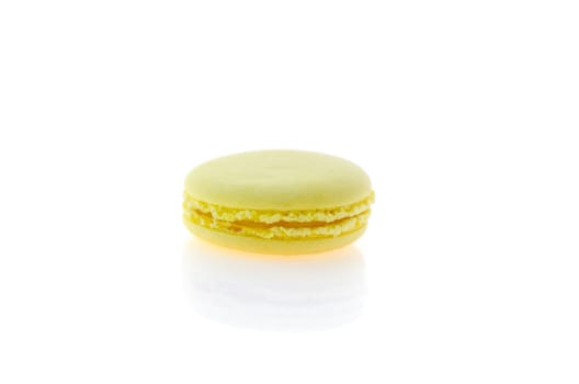  yellow  french macaroons over white background , single  dessert