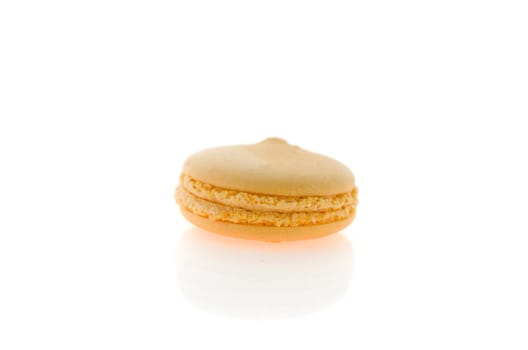 yellow  french macaroons over white background , single  dessert