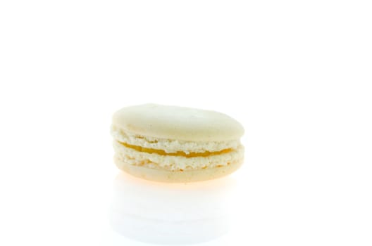 cream  french macaroons over white background , single  dessert