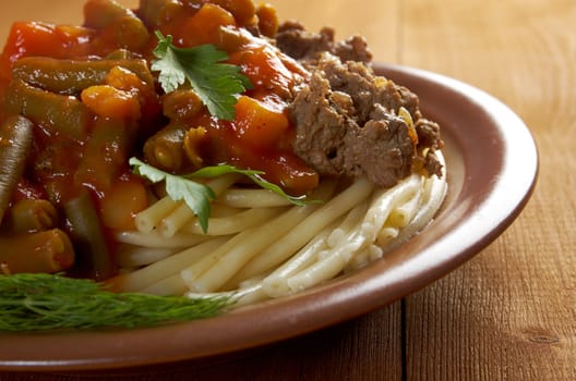  pasta with  beef ,vegetable  tomato sauce  on wooden table