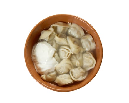 Traditional Russian food "pelmeni".Meat dumplings  with sour cream