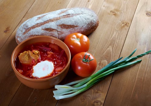 ukrainian and russian red-beet soup (borscht) with garlic and sour cream