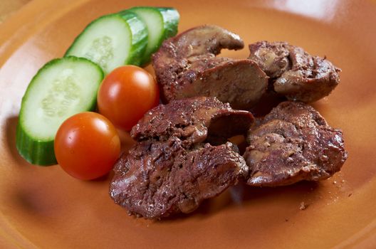 Chicken livers and vegetable.closeup