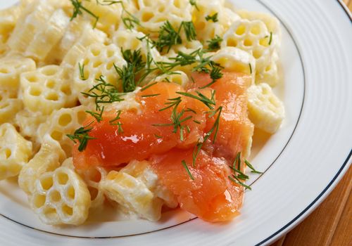 ruote pasta with cream sauce and salmon.closeup