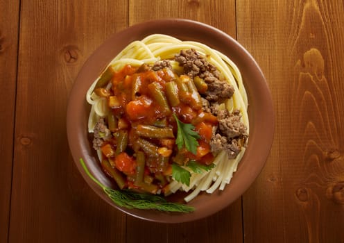  pasta with  beef ,vegetable  tomato sauce  on wooden table