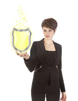 young woman holding shiny yellow shield isolated on white background