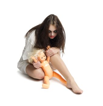 Zombie girl with plastic doll