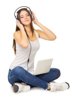 Young girl listening misoc by headphones isolated