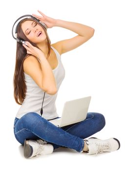 Young girl listen music by headphones isolated