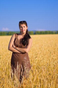 Young woman on wheat field