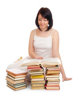 Young smiling woman with heap of books isolated