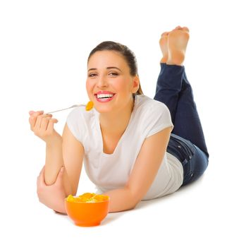 Young girl laying on the floor with fruit salad isolated