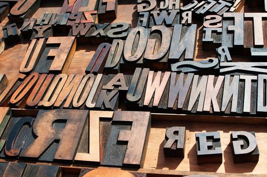 A bunch of old vintage wooden block printing press letters.