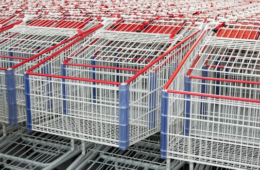 American shopping carts that are stacked together.