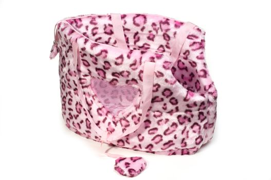 pink leopard print bag for small dogs on isolated white background.