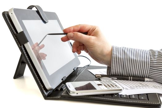Business woman hand typing on touch screen of digital tablet