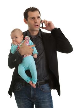 Portrait of businesman with his baby girl speaking on mobile phone