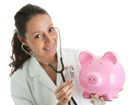 Doctor inspecting piggy bank. Isolated on white