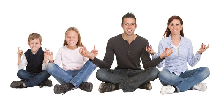 Cheeful young couple doing yoga exercise. Isolated on white