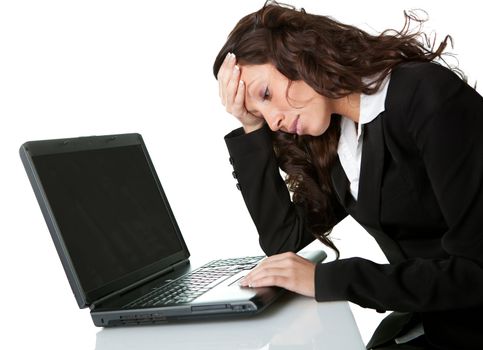 Stressful business woman working on laptop. Isolated on white