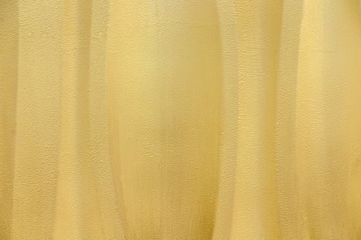 Yellow textured wavey wall background abstract