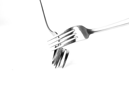 Shiny stainless steel forks on a white background