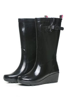 black rubber boots on white background with pink insides.