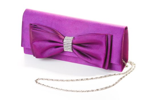 a purple clutch with bow and diamonds.
