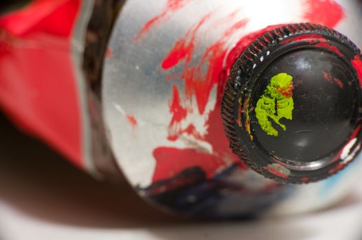 Macro shot of red metal paint tube