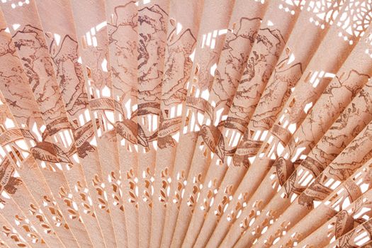 Macro shot of a fan with floral pattern