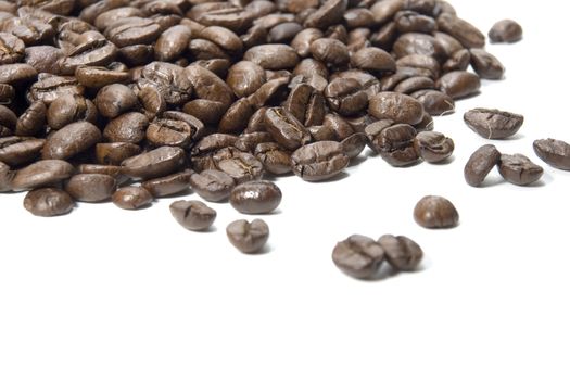 Fresh roasted coffee beans on a white background