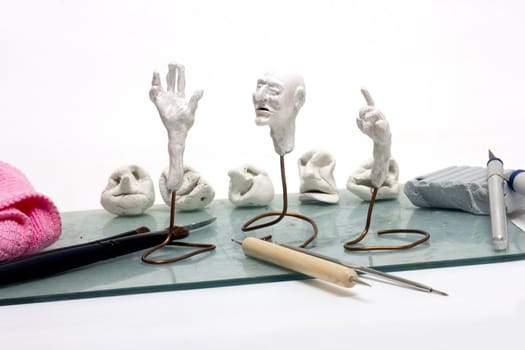 Workplace sculptor miniaturist. Working with polymer clay.