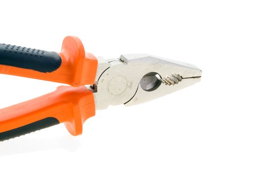 Steel used pliers with plastic color handles on a white background